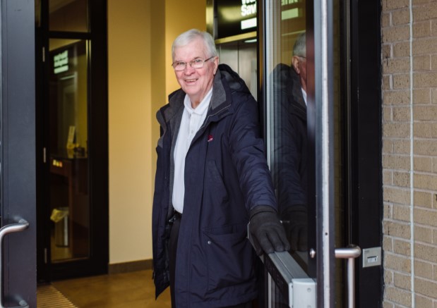 Tom opening the door at the Main office of Watertown Savings Bank